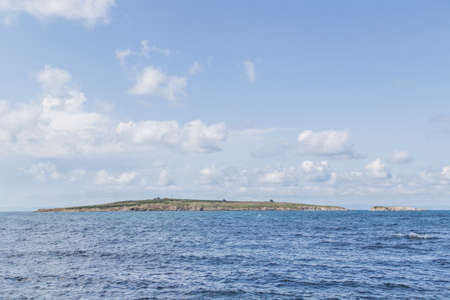 blue sea island land sky