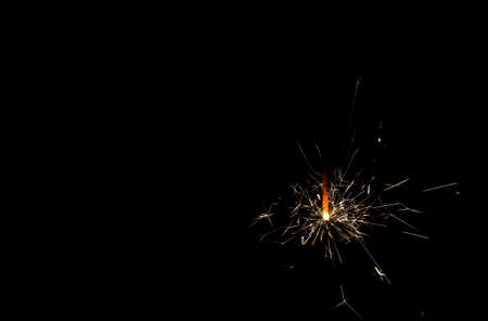 sparkler burning on a black backgroundの写真素材