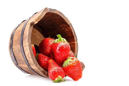 Strawberry wooden bucket Isolated on white backgroundの写真素材