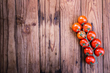 tomatoes on a wooden backgroundの写真素材