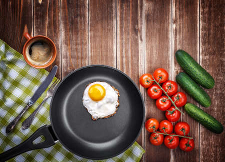 food fried egg pan cucumber tomato coffeeの写真素材