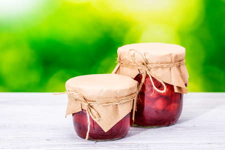 jar strawberry jam blur nature wooden tableの写真素材