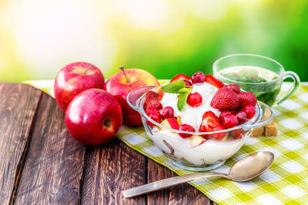 fruit, tea, breakfast on nature background blurredの写真素材