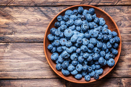 berry blueberries on a wooden backgroundの写真素材