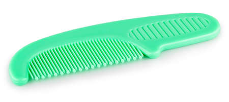 green comb on a white background with shadowの写真素材