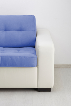 White leather sofa isolated against the wallの写真素材