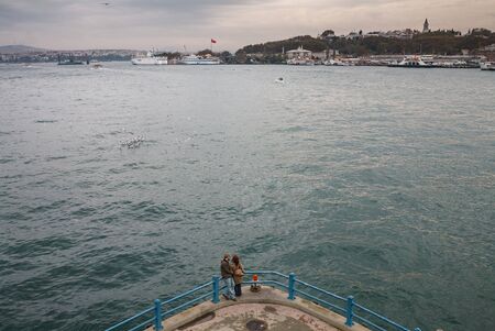 The couple on the bridge on  Bosphorus in Istanbulの写真素材