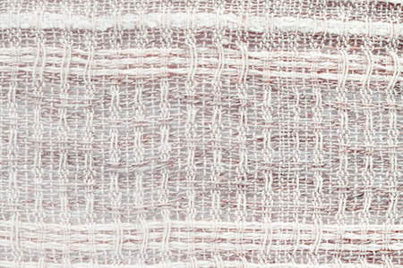 Red hand weaving matting tweed fabric texture. Closeup horizontal fragment