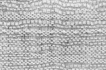 White hand weaving matting tweed fabric texture. Closeup horizontal fragmentの写真素材