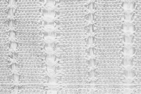 White hand weaving matting tweed fabric texture. Closeup horizontal fragment