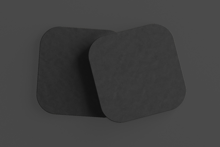 Black coasters. Isolated on black background. Include clipping path. 3d renderの写真素材