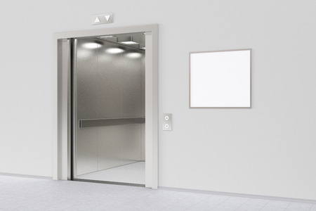 Elevator with open doors and blank poster or billboard in the modern office lobby. Include clipping...