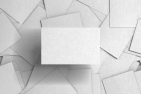 Blank white business card above pile of white business cards background. 3d renderの写真素材