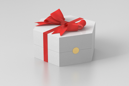 White hexagon gift box with red bow isolated on white background with clipping path. 3d renderの写真素材