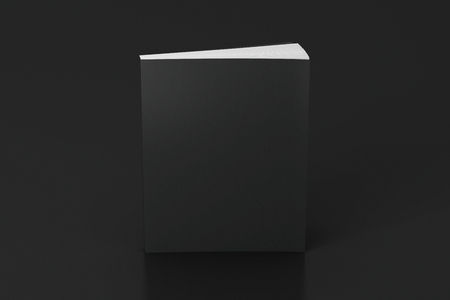 Blank black vertical soft cover book standing on black background. Isolated with clipping path around book. 3d illustrationの写真素材