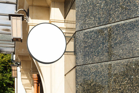Blank round singboard on granite the wall. 3d illustrationの写真素材