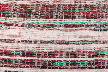 Red handmade matting tweed texture clouseup.