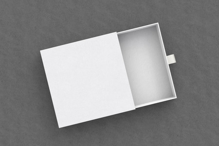 Opened empty white drawer sliding box on gray background. Isolated with clipping path around box. 3d...