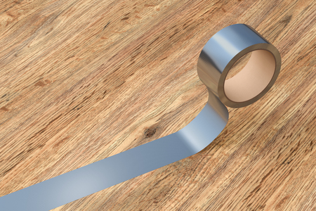 Silver duct tape roll on wooden background. 3d illustration.の写真素材