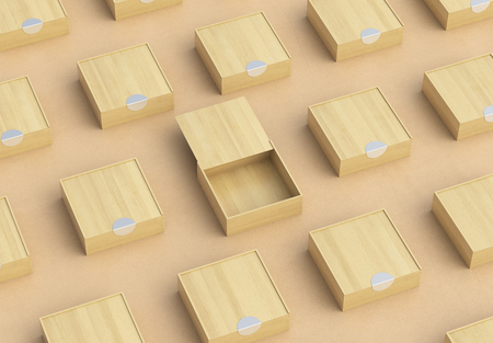 Empty light wooden square box with opened sliding lid with closed boxes around on beige leather...
