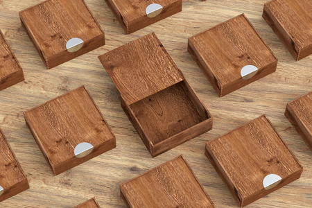 Empty wooden square box with opened sliding lid with closed boxes around on wooden background. 3d illustrationの写真素材