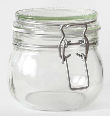Glass jar with lid isolated on white の写真素材