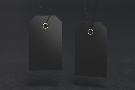 Blank black price tag label mockup on black background. 3d illustrationの写真素材
