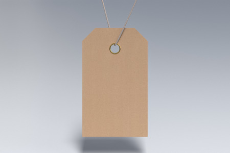 Blank craft paper price tag label mockup hanging on white background. 3d illustrationの写真素材