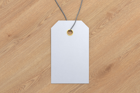 Blank white price tag label mockup on wooden background. 3d illustrationの写真素材