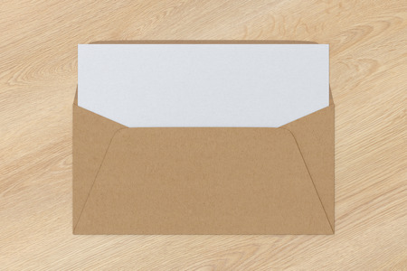 Craft paper blank envelope with blank letter inside on wooden background. 3d renderの写真素材