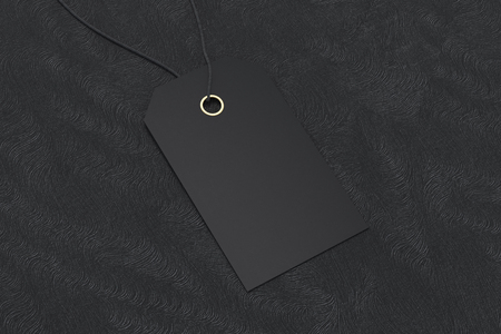 Blank black price tag label mockup on black background. 3d illustrationの写真素材