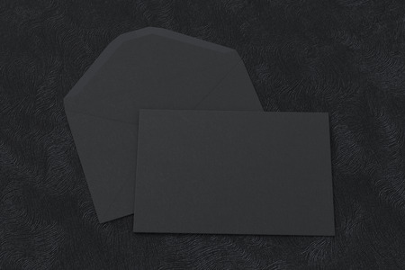 Black blank closed envelope on opened envelope on black background. 3d renderの写真素材