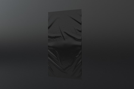 Blank black vertical wrinkled street poster on black wall.の写真素材