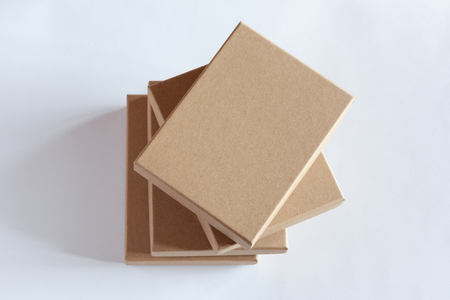 Stack of four blank closed carton boxes packaging isolated on white background. View above.