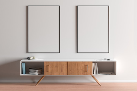 Two blank vertical posters mock up with black frame above the cabinet in living room interior. 3d...