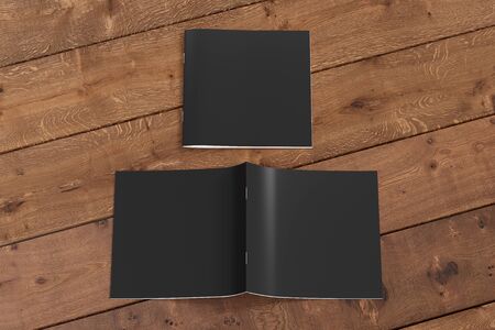 Black square brochure or booklet cover mock up on wooden background. Closed one brochure and upside down other. Clipping path around brochure. Front view. 3d illustratuionの写真素材