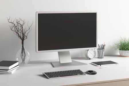 Workspace with blank computer monitor black screen mock up on the white desk near white wall....
