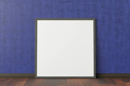 Blank square poster frame mock up standing on dark parquet floor next to blue wall.