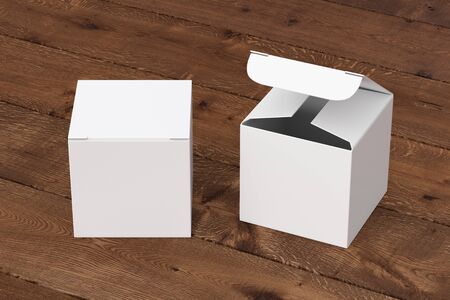 Blank white cube gift box with open and closed hinged flap lid on dark wooden background.