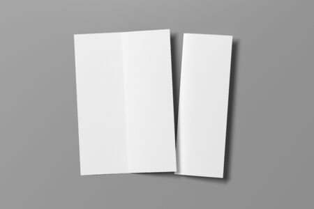 Blank vertical A4 leaflet on gray background. Bi-fold or half-fold opened and folded brochure isolated. View directly above. 3d illustrationの写真素材
