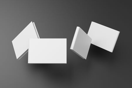 Horizontal blank book cover mock up flying over black background. Front, spine and back cover views. 3d illustrationの写真素材