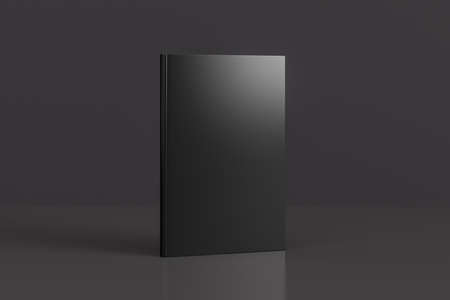 Hardcover vertical black mockup book standing on the black background. 3d illustrationの写真素材