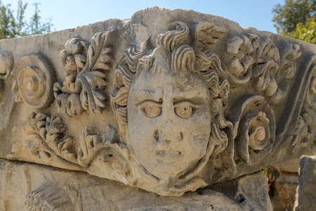 Stone faces and masks of ancient theater in Myra. Demre, Antalya, Turkeyの写真素材
