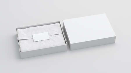 Gift box mock up with cover. White gift box with blank label or business card on wrapping paper. White background. Side view. 3d illustrationの写真素材