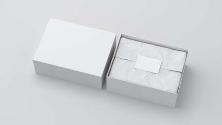 Gift box mock up with cover. White gift box with blank label or business card on wrapping paper. White background. Side view. 3d illustrationの写真素材
