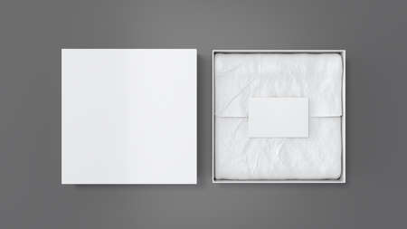 Square gift box mock up. White gift box with blank label or business card on wrapping paper. Gray background. View directly above. 3d illustrationの写真素材
