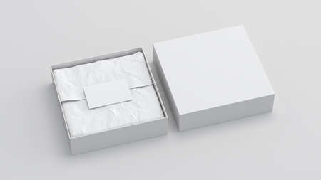 Square gift box mock up. White gift box with blank label or business card on wrapping paper. White background. Side view. 3d illustrationの写真素材