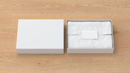 Gift box mock up with cover. White gift box with blank label or business card on wrapping paper. Wooden background. Front view. 3d illustrationの写真素材