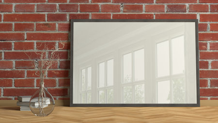 Horizontal poster frame mock up on the floor in living room with wooden floor and red brick wall. 3d illustrationの写真素材