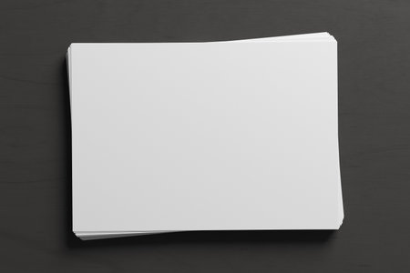 Stack of paper mockup on the black background. 3d illustrationの写真素材